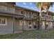 Condominium exterior featuring two-story units with private balconies and well-maintained grounds at 6330 Newtown Cir # 30B4, Tampa, FL 33615