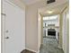 Entrance into the kitchen with white cabinetry and stainless steel appliances at 6330 Newtown Cir # 30B4, Tampa, FL 33615