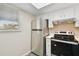 Well-lit kitchen featuring stainless steel refrigerator and range oven at 6330 Newtown Cir # 30B4, Tampa, FL 33615