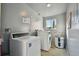 Laundry room with washer, dryer, and water heater at 6330 Newtown Cir # 30B4, Tampa, FL 33615