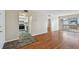 Open living room leading to the kitchen and balcony at 6330 Newtown Cir # 30B4, Tampa, FL 33615