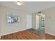 Inviting living room with wood flooring and a view into the kitchen area at 6330 Newtown Cir # 30B4, Tampa, FL 33615