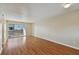 Bright living room featuring wood floors and a sliding door to a balcony at 6330 Newtown Cir # 30B4, Tampa, FL 33615