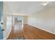 Bright living room boasts hardwood floors and sliding glass doors to the balcony, enhancing natural light at 6330 Newtown Cir # 30B4, Tampa, FL 33615