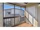 Enclosed patio featuring wood railings and tile flooring at 6330 Newtown Cir # 30B4, Tampa, FL 33615