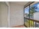 Screened-in patio with tile flooring and view of palm trees and community pool at 6330 Newtown Cir # 30B4, Tampa, FL 33615