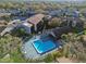 An aerial view shows the community's attractive pool area and well-maintained landscaping at 6330 Newtown Cir # 30B4, Tampa, FL 33615