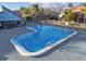 Community pool with unique shape, offering a refreshing space for relaxation and recreation at 6330 Newtown Cir # 30B4, Tampa, FL 33615