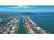 Breathtaking aerial view of waterfront homes and canals in a coastal community, near open water at 684 Harbor Is, Clearwater Beach, FL 33767