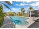 Sparkling in-ground pool in a private backyard setting, perfect for relaxation and entertainment at 684 Harbor Is, Clearwater Beach, FL 33767