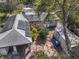 Aerial view of property featuring solar panels, shed, and mature trees at 7101 8Th N Ave, St Petersburg, FL 33710