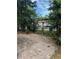 Backyard view featuring a fenced yard, trees, and brick paver ground covering at 7101 8Th N Ave, St Petersburg, FL 33710