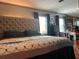 This bedroom features hardwood floors, decorative dark gray trim, and two windows at 7101 8Th N Ave, St Petersburg, FL 33710