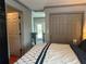 This bedroom features hardwood floors, decorative dark gray trim, and a large closet at 7101 8Th N Ave, St Petersburg, FL 33710