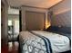 This bedroom features hardwood floors, decorative dark gray trim, and a large closet at 7101 8Th N Ave, St Petersburg, FL 33710