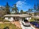 Charming single-story home features a carport, brick driveway, and well-maintained landscaping at 7101 8Th N Ave, St Petersburg, FL 33710
