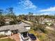 Elevated view of the home showing the covered parking area and lush yard at 7101 8Th N Ave, St Petersburg, FL 33710