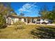 Charming home featuring a covered parking area, lush lawn, and inviting curb appeal at 7101 8Th N Ave, St Petersburg, FL 33710
