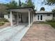 Street view of home with carport at 7101 8Th N Ave, St Petersburg, FL 33710