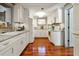 Modern kitchen featuring white cabinets, granite countertops, and stainless steel appliances at 7101 8Th N Ave, St Petersburg, FL 33710
