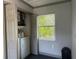 Laundry room with white washer, dryer, and window at 7101 8Th N Ave, St Petersburg, FL 33710
