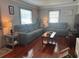 Cozy living room with hardwood floors, neutral walls, two sofas, and plenty of natural light at 7101 8Th N Ave, St Petersburg, FL 33710