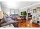 Comfortable living room featuring hardwood floors, two couches, and a view to other rooms at 7101 8Th N Ave, St Petersburg, FL 33710
