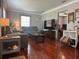 Bright living room with hardwood floors, neutral walls, and a large television at 7101 8Th N Ave, St Petersburg, FL 33710