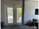 Bright room featuring double doors leading to outside, carpet and a neutral color scheme at 7101 8Th N Ave, St Petersburg, FL 33710