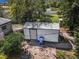 Aerial view of a storage shed with a blue trash bin and brick walkway at 7101 8Th N Ave, St Petersburg, FL 33710