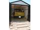 The shed interior houses a truck with exposed rafters at 7101 8Th N Ave, St Petersburg, FL 33710