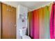 Cozy bathroom featuring a colorful shower curtain and white fixtures at 9790 66Th N St # 158, Pinellas Park, FL 33782