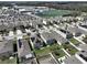 Overhead shot of houses and neighborhood near schools, showing Gathering-friendly amenities at 10967 Carlton Fields Dr, Riverview, FL 33579