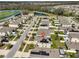 A neighborhood with houses, green spaces, and a lake visible in the distance at 10967 Carlton Fields Dr, Riverview, FL 33579