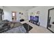 A bedroom with TV, art and bed at 10967 Carlton Fields Dr, Riverview, FL 33579