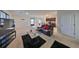 Open living area with cozy seating, a TV, and a view of the kitchen at 10967 Carlton Fields Dr, Riverview, FL 33579
