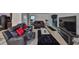 Open living area with cozy seating, a TV, and a view of the kitchen at 10967 Carlton Fields Dr, Riverview, FL 33579