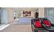 Living room seating overlooking a kitchen with dark cabinets and light countertops at 10967 Carlton Fields Dr, Riverview, FL 33579