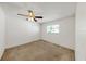 Bedroom with a window, closet, and ceiling fan with traditional lighting at 1137 54Th S Ave, St Petersburg, FL 33705