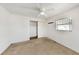 Bedroom featuring ceiling fan, window with blinds, and closet space at 1137 54Th S Ave, St Petersburg, FL 33705