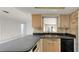 Well-lit kitchen with dual sink and open window at 1137 54Th S Ave, St Petersburg, FL 33705