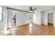 Spacious living room featuring wood floors, ceiling fan, and natural light at 1137 54Th S Ave, St Petersburg, FL 33705