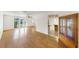 Open-concept living space featuring hardwood floors and view into kitchen at 1137 54Th S Ave, St Petersburg, FL 33705