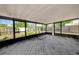 Screened-in patio with wood flooring and views of the backyard at 1137 54Th S Ave, St Petersburg, FL 33705