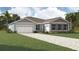 Charming single-story home with a two-car garage and a well-manicured front yard at 11953 Vista Park Ter, Venice, FL 34293