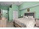 This primary bedroom features a king size bed, fresh paint, and a wardrobe at 1489 Ridge Shore Dr, Tarpon Springs, FL 34689