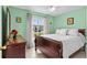 Inviting bedroom with a large window and light green walls at 1489 Ridge Shore Dr, Tarpon Springs, FL 34689