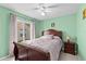 Comfortable bedroom with a window and green walls at 1489 Ridge Shore Dr, Tarpon Springs, FL 34689