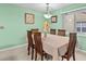 The dining room features neutral wall color, tile floors and a stylish light fixture at 1489 Ridge Shore Dr, Tarpon Springs, FL 34689