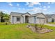 Well-kept home featuring manicured landscaping and a welcoming entrance at 1489 Ridge Shore Dr, Tarpon Springs, FL 34689